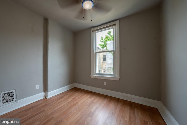 unfurnished room featuring ceiling fan and light hardwood / wood-style floors