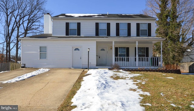 view of front property featuring a front lawn and a porch