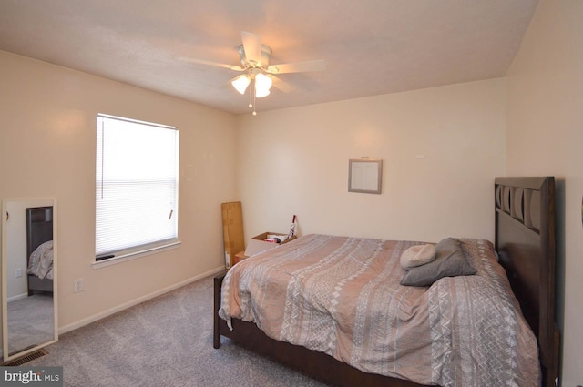 bedroom with ceiling fan and carpet flooring