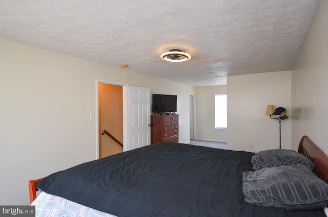 bedroom featuring a textured ceiling