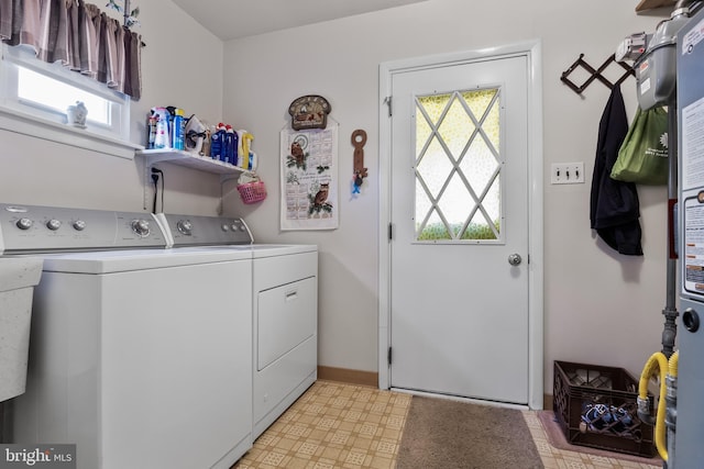 washroom with washing machine and clothes dryer