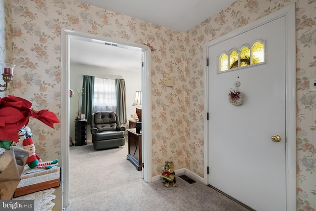 entrance foyer featuring carpet floors