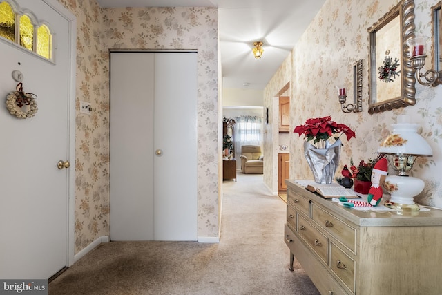 hallway with light colored carpet and a wealth of natural light