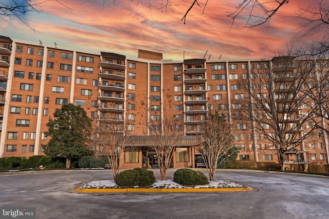 view of outdoor building at dusk