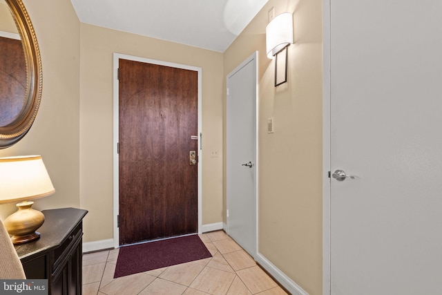 foyer featuring light tile patterned flooring