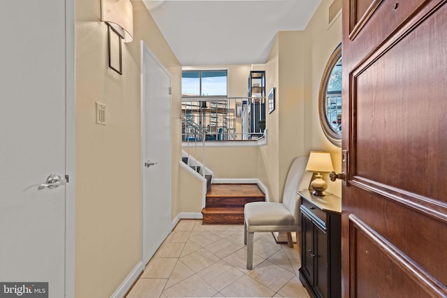 hallway with light tile patterned floors