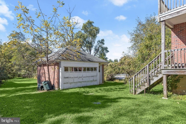 exterior space featuring a garage and an outdoor structure