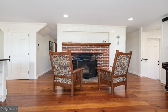 7705 Quaker Neck Rd, Bozman, MD 21612 - living area with wood finished floors, baseboards, a fireplace, ornamental molding, and recessed lighting