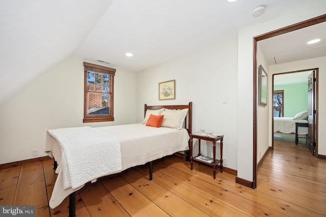 7705 Quaker Neck Rd, Bozman, MD 21612 - bedroom with light wood-type flooring, baseboards, lofted ceiling, and recessed lighting