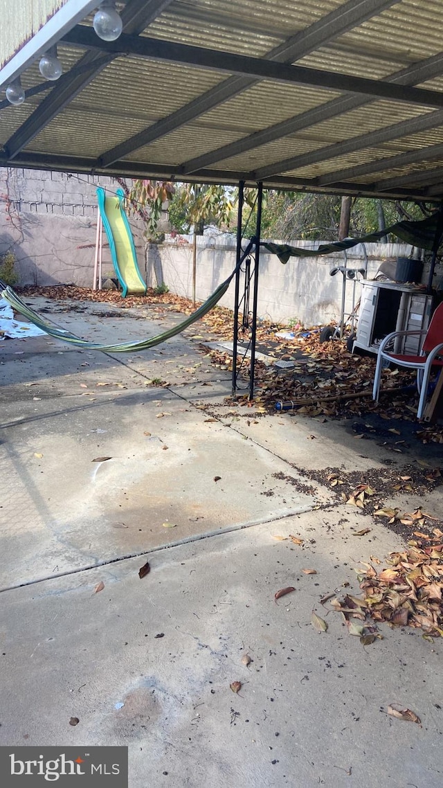 view of patio featuring a playground