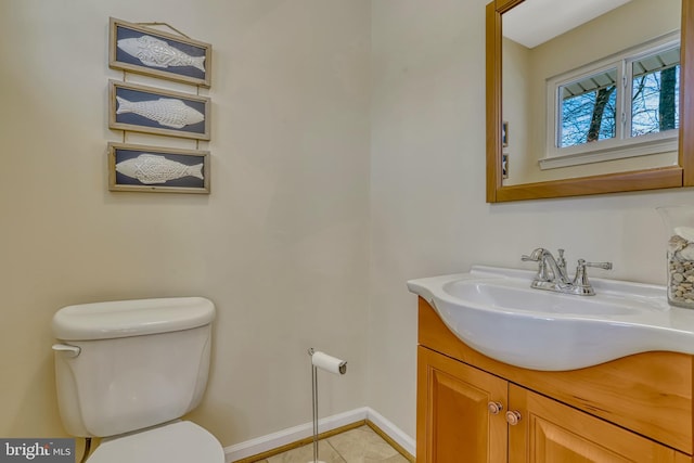 bathroom with toilet and vanity