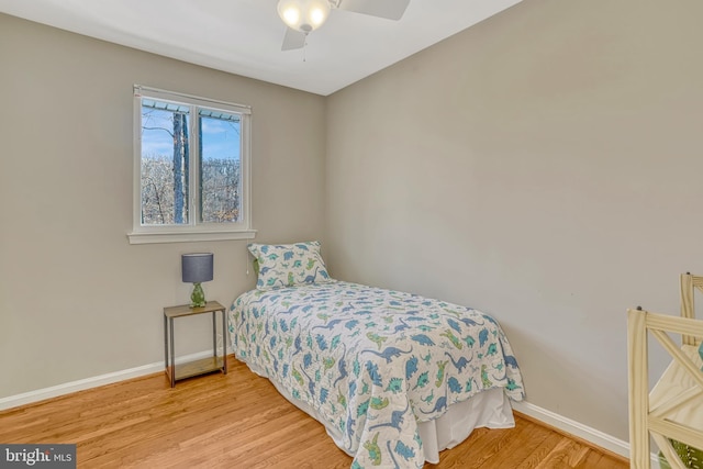 bedroom featuring light wood-type flooring and ceiling fan