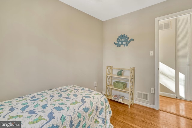 bedroom featuring a closet and hardwood / wood-style flooring