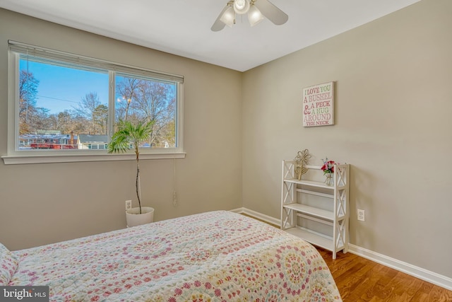 bedroom featuring ceiling fan and wood-type flooring