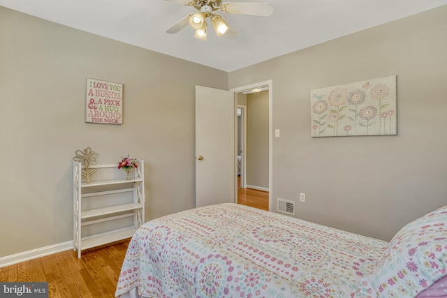 bedroom featuring ceiling fan and wood-type flooring