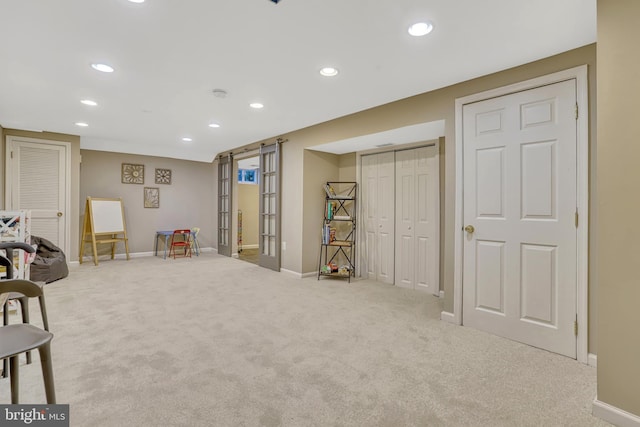 interior space featuring light colored carpet