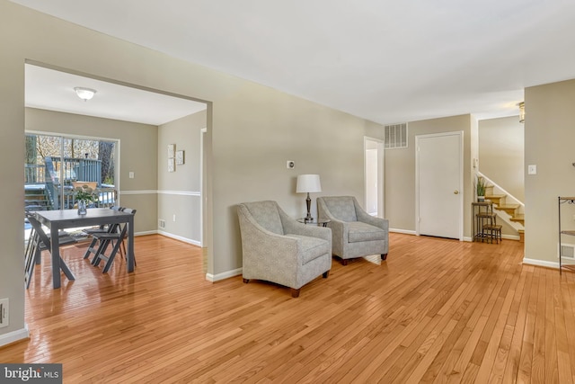 sitting room with light hardwood / wood-style flooring