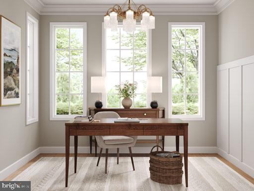 office featuring ornamental molding, plenty of natural light, and an inviting chandelier