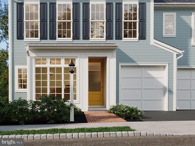 entrance to property featuring a garage