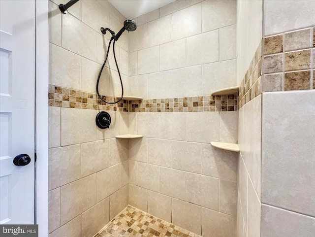 bathroom featuring tiled shower