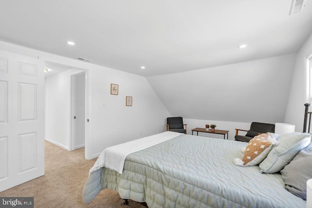 carpeted bedroom with vaulted ceiling