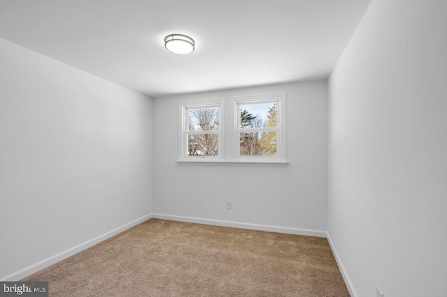 spare room with light carpet