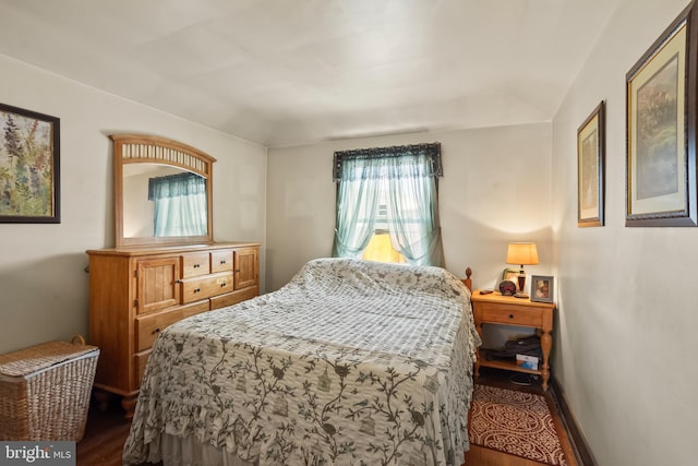 bedroom with hardwood / wood-style floors