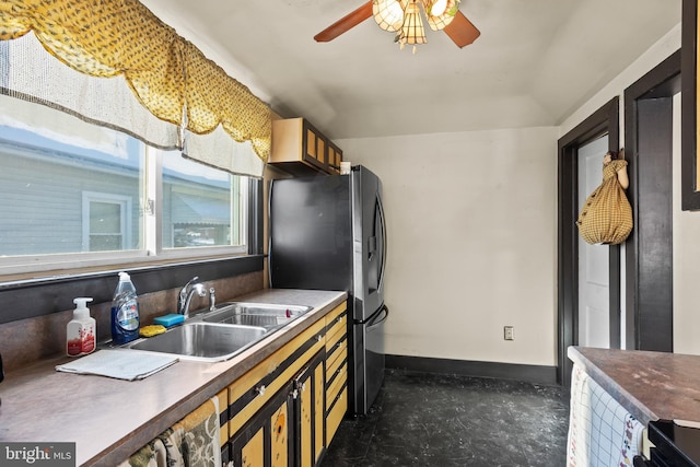 kitchen with sink, stainless steel fridge, and ceiling fan