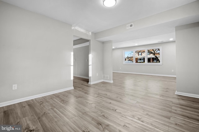 spare room featuring light wood-type flooring