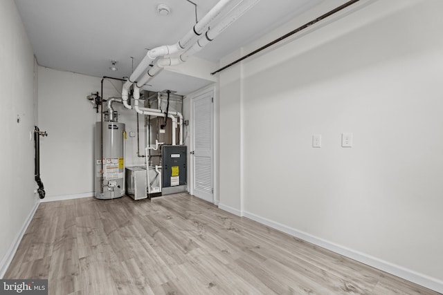 utility room featuring water heater