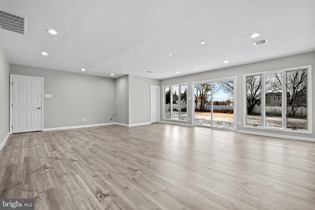 unfurnished living room featuring light wood-type flooring