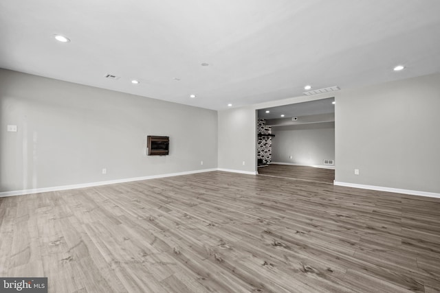 unfurnished living room with light wood-type flooring