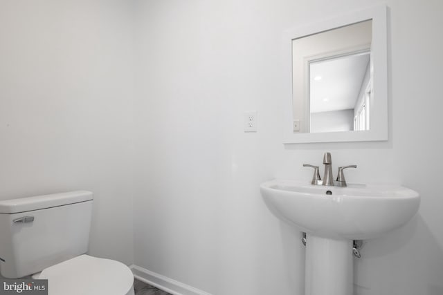 bathroom with sink and toilet