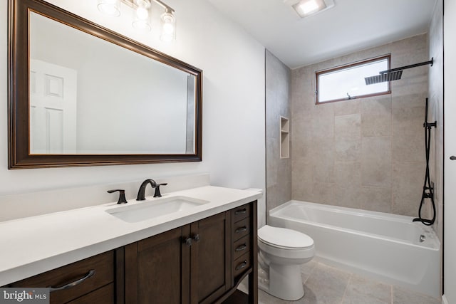 full bathroom with toilet, tile patterned floors, tiled shower / bath, and vanity