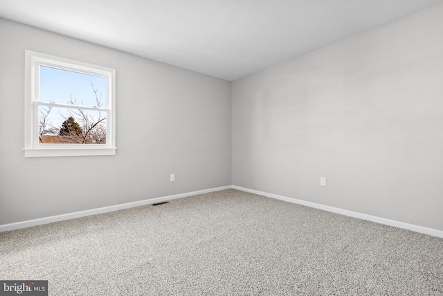 unfurnished room with carpet flooring