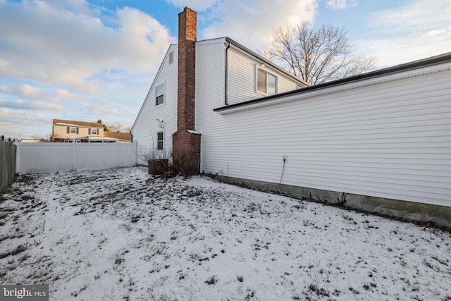 view of snow covered house