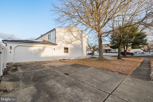 view of property exterior featuring a garage