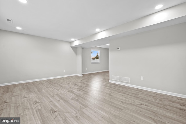 basement featuring light hardwood / wood-style flooring