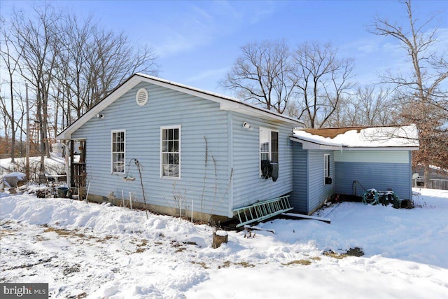 view of snow covered house