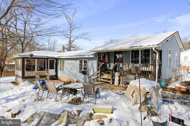 view of snow covered house