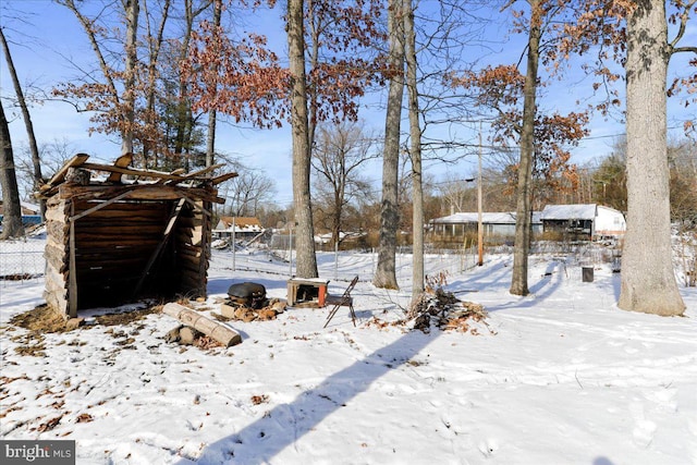 view of yard layered in snow