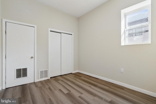 unfurnished bedroom with light hardwood / wood-style floors