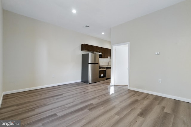 unfurnished living room with light hardwood / wood-style floors