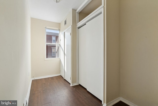 hallway featuring dark hardwood / wood-style floors