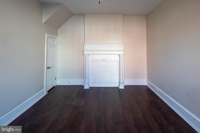 additional living space featuring dark hardwood / wood-style floors