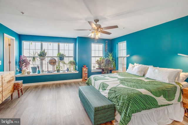 bedroom featuring ceiling fan and hardwood / wood-style floors