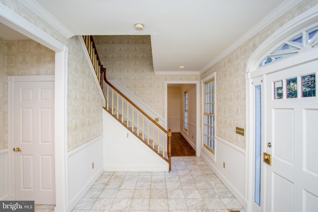 entrance foyer featuring crown molding