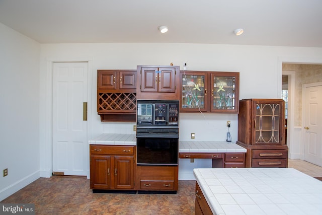 kitchen with black appliances and tile counters