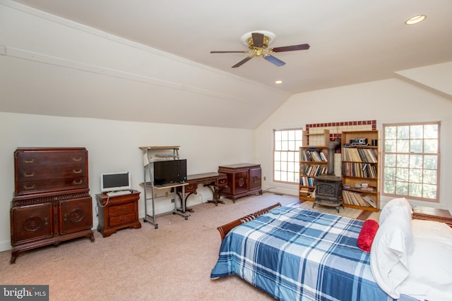 carpeted bedroom featuring ceiling fan and vaulted ceiling