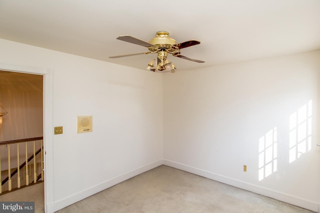 unfurnished room with light carpet and ceiling fan